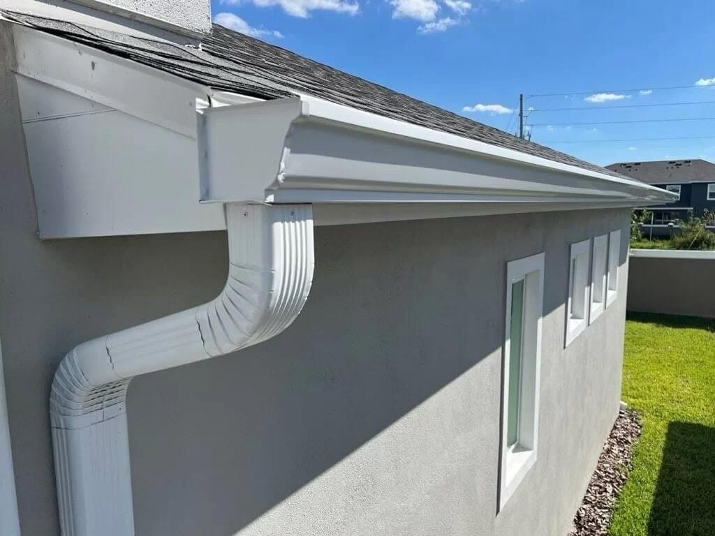 White K5 style seamless gutter along a tile-roof Southern California home